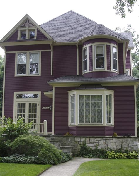 purple house with green metal roof|light purple house exterior.